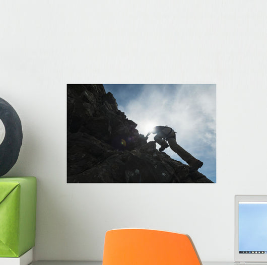 Man scrambling up ridge in the Black Cuillin Wall Mural
