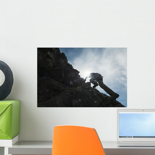 Man scrambling up ridge in the Black Cuillin Wall Mural