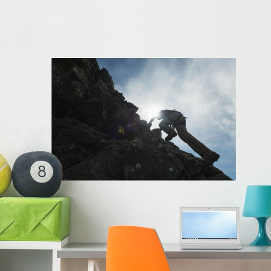 Man scrambling up ridge in the Black Cuillin Wall Mural