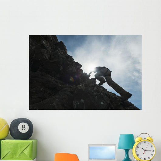 Man scrambling up ridge in the Black Cuillin Wall Mural