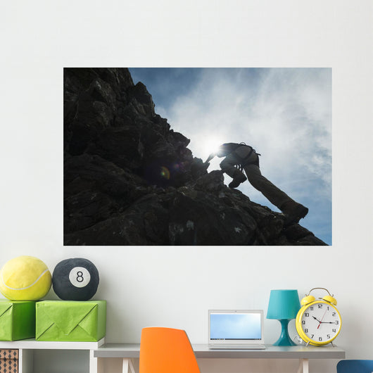 Man scrambling up ridge in the Black Cuillin Wall Mural