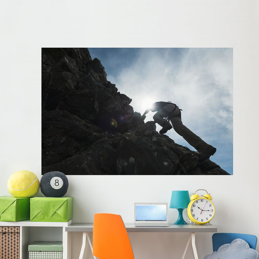 Man scrambling up ridge in the Black Cuillin Wall Mural