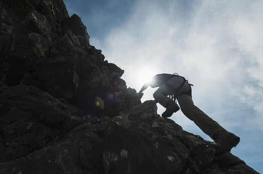 Man scrambling up ridge in the Black Cuillin Wall Mural