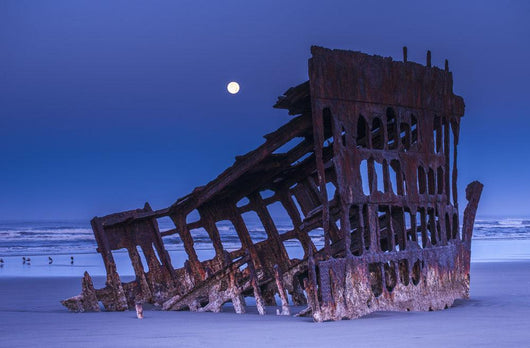 The moon sets over the wreck of the Peter Iredale Wall Mural