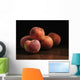 Peaches sitting on a wooden table Wall Mural