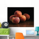Peaches sitting on a wooden table Wall Mural