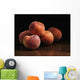 Peaches sitting on a wooden table Wall Mural