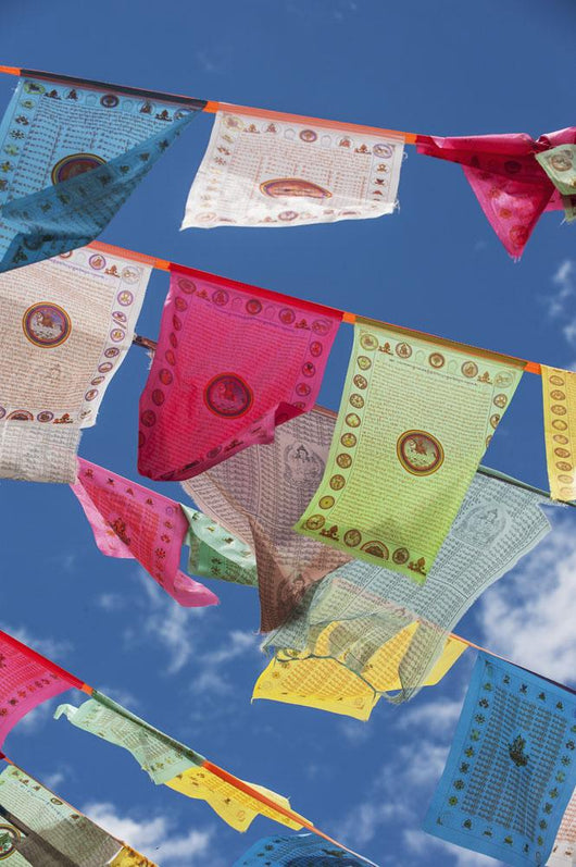 Prayer flags in the breeze Wall Mural
