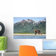 Coastal Brown Bear walking beneath mountain peaks along Kukak Bay Wall Mural