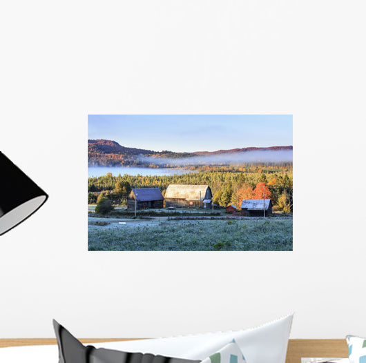 Rustic buildings and barn among autumn colors at sunrise Wall Mural