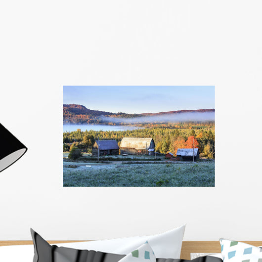 Rustic buildings and barn among autumn colors at sunrise Wall Mural
