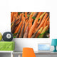 Green plastic baskets with freshly picked organic carrots for sale Wall Mural