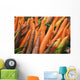 Green plastic baskets with freshly picked organic carrots for sale Wall Mural