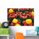 Green plastic baskets with organic red and yellow bell peppers Wall Mural