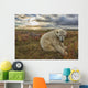 Polar bear sitting in the grass along the shorline of Hudson Bay Wall Mural