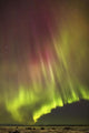 Northern Lights in the sky above the snow covered mudflats of Knik Arm Wall Mural