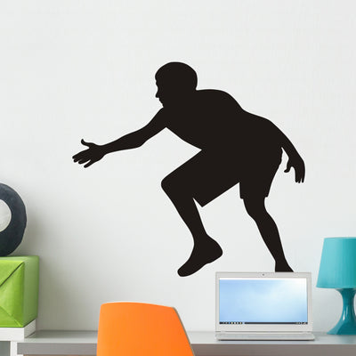 Silhouette Basketball Player Wall Decal shown on a wall