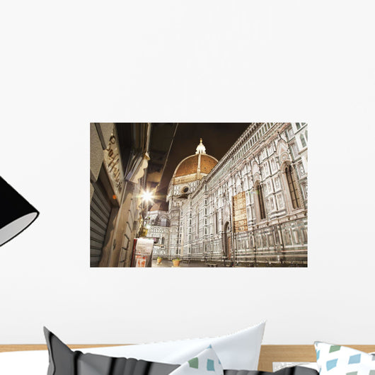 Buildings and Florence Cathedral illuminated a nighttime Wall Mural