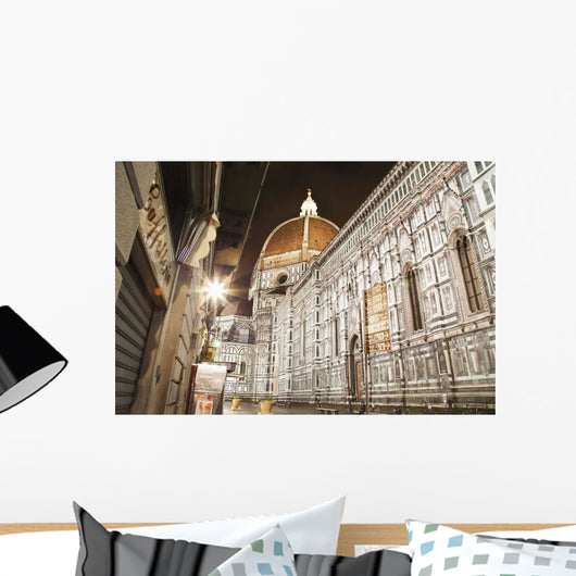 Buildings and Florence Cathedral illuminated a nighttime Wall Mural