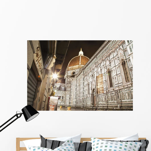 Buildings and Florence Cathedral illuminated a nighttime Wall Mural
