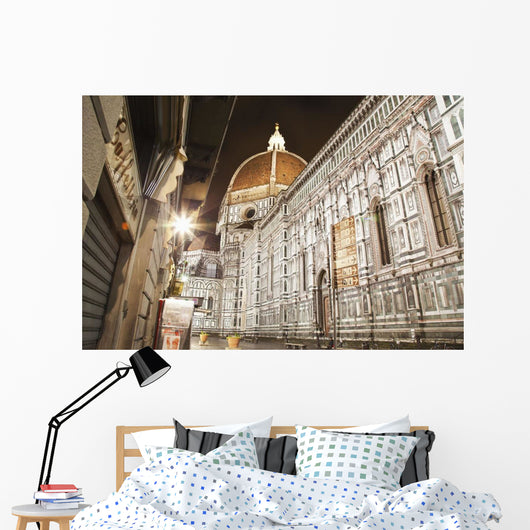 Buildings and Florence Cathedral illuminated a nighttime Wall Mural