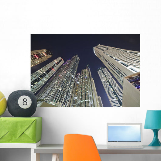 Skyscrapers illuminated at nighttime Wall Mural