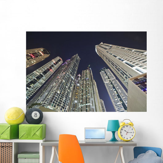 Skyscrapers illuminated at nighttime Wall Mural