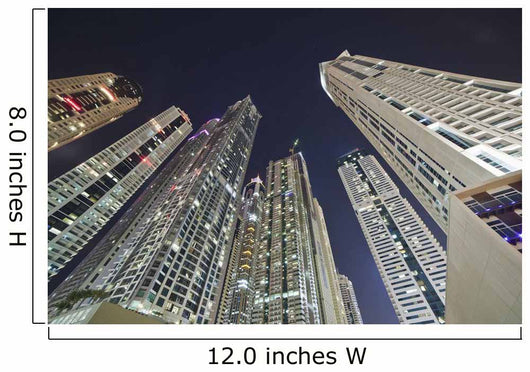 Skyscrapers illuminated at nighttime Wall Mural