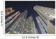 Skyscrapers illuminated at nighttime Wall Mural
