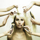 Model and Hands of Stylists Wall Mural