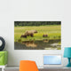 Adult sow Grizzly bear with two cubs Wall Mural