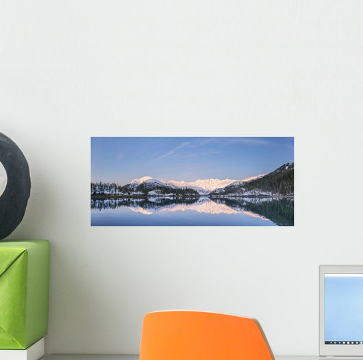 Snowy scenic reflected in the waters of Harrison Lagoon at sunrise Wall Mural