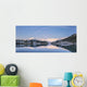 Snowy scenic reflected in the waters of Harrison Lagoon at sunrise Wall Mural