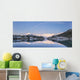 Snowy scenic reflected in the waters of Harrison Lagoon at sunrise Wall Mural