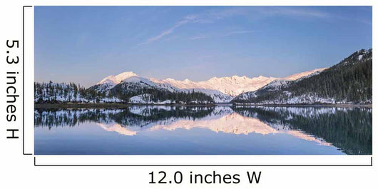 Snowy scenic reflected in the waters of Harrison Lagoon at sunrise Wall Mural