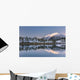 Snowy scenic reflected in the waters of Harrison Lagoon at sunrise Wall Mural
