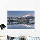 Snowy scenic reflected in the waters of Harrison Lagoon at sunrise Wall Mural