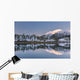 Snowy scenic reflected in the waters of Harrison Lagoon at sunrise Wall Mural