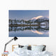 Snowy scenic reflected in the waters of Harrison Lagoon at sunrise Wall Mural