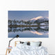 Snowy scenic reflected in the waters of Harrison Lagoon at sunrise Wall Mural