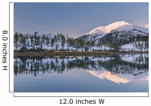 Snowy scenic reflected in the waters of Harrison Lagoon at sunrise Wall Mural