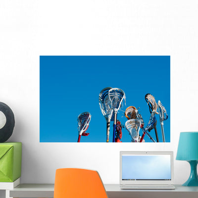 Many Lacrosse Sticks Air Wall Mural shown on a wall