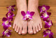 Feet and Orchids Wall Mural