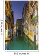 Turquoise water in a narrow canal between buildings at dusk Wall Mural