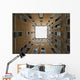 Low angle view to the sky from inside the four walls of a building Wall Mural