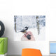 Hand feeding a black-capped chickadee sunflower seeds Wall Mural