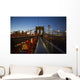 Pedestrian path on Brooklyn Bridge heading into Manhattan at night Wall Mural
