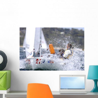 Splashing Sailboat Wall Mural shown on a wall