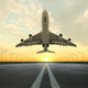 takeoff plane in airport at sunset Wall Mural