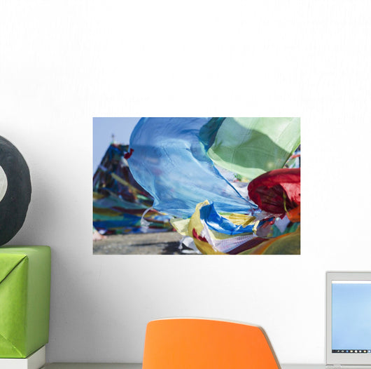 Blessing colourful Tibetan prayer flags under the blue sky Wall Mural